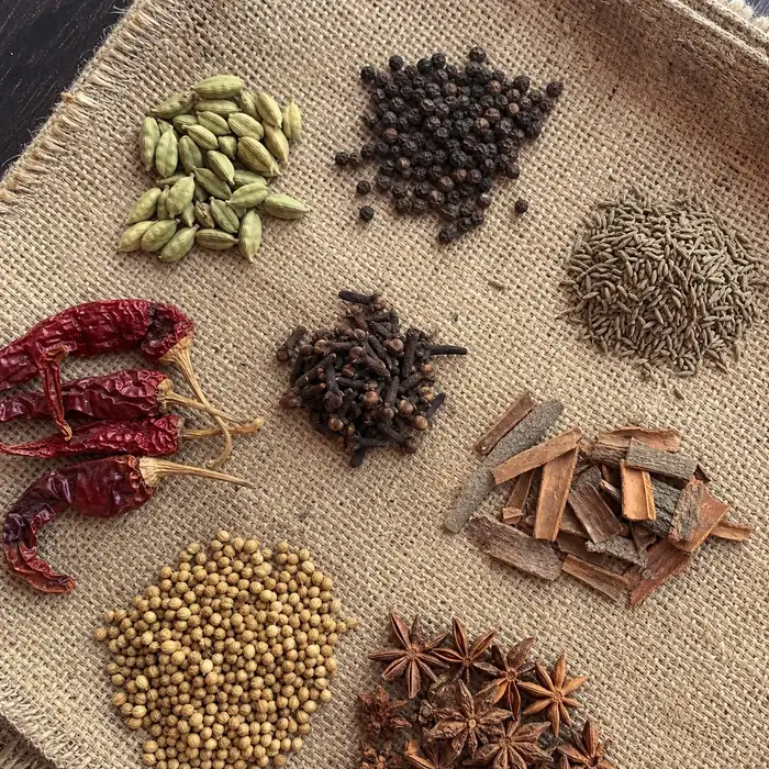 Whole spices arranged on a jute cloth